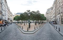 Parisian enjoying life at Place Dauphine in the evening