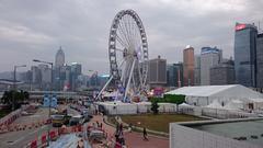 Central Hong Kong skyline with tall buildings and mountains in the background