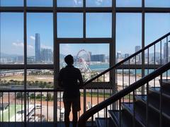 HK Central City Hall interior stairs with glass window overlooking Promenade Waterfront and Victoria Harbour