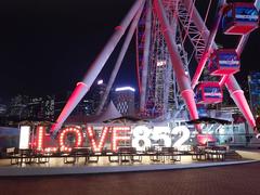 Central Waterfront Promenade with Hong Kong Observation Wheel at night