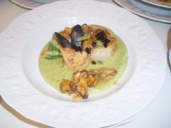 Seafood dish served on a white plate