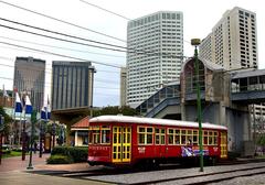 New Orleans red streetcar on riverfront