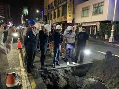 Charles Lin inspecting road collapse at Kaisyuan Night Market in Kaohsiung during Tropical Storm Lupit (2021)