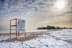 Empty lifeguard post on Woodbine Beach with remnants of snow