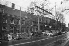 Exterior view of the Amsterdams Historisch Museum with part of the restored roof covering being removed, dated December 7, 1973, Amsterdam, Netherlands