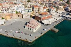 Carriages waiting for tourists near the Mosque Küçük Hasan in Chania, Greece