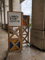 Sign for Lisboa Story Centre in Praça do Comércio, Lisbon