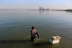 Fisherman sets out for a day of fishing at Las Piñas-Parañaque Critical Habitat and Ecotourism Area