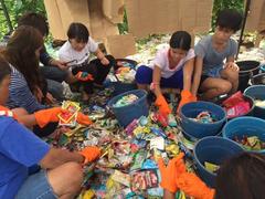 volunteers cleaning up a beach in Freedom Island, Paranaque, Philippines