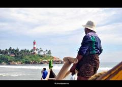 Kovalam fisherman pulling net from sea