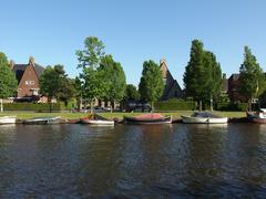 Scenic canal view with trees and grassy areas in Beatrixpark, Amsterdam