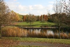 Beatrixpark in South Amsterdam with a pathway, green trees, and people strolling