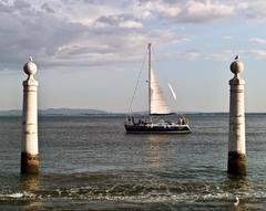 photographers shooting against the Tagus River in Lisbon Portugal