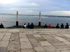 Lisbon cityscape with a view of red rooftops and the Tagus River