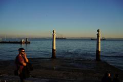 Cais das Colunas waterfront in Lisbon with Tagus River and blue sky