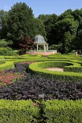 Boxwood Garden with neatly trimmed bushes and stone pathway