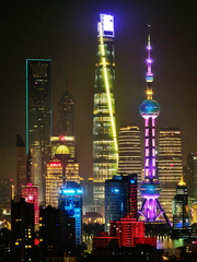 Shanghai skyline at night with illuminated skyscrapers