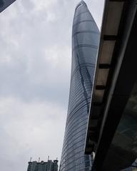 Shanghai Tower skyscraper against a blue sky