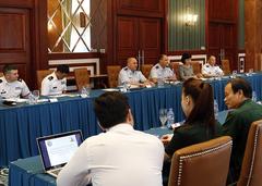 Vice Admiral Pham Ngoc Minh and Brigadier General Michael E. Stencel in discussions