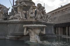 Fountain with statues in front of the Austrian Parliament Building in Vienna