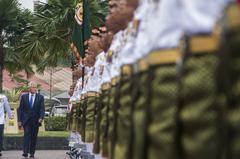 U.S. Secretary of Defense Chuck Hagel reviews Malaysian troops