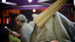 Beat with stick at Raohe St. Night Market