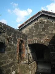 Cannon on stone fortification at Baluarte de San Diego in Intramuros, Manila