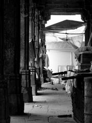 Graves covered with brocade inside Rani no Hajiro, with a cloister and intricately carved stone screens