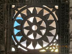 intricate stone lattice work at Rani no Hajiro