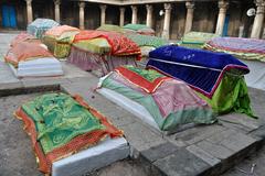 Colorful covers adorn the tombs of queens at Rani No Hajiro in Ahmedabad