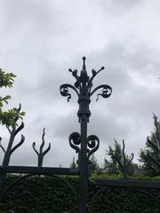 close-up view of ornamental ironwork and an open flower at the Rijksmuseum