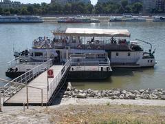 D13 boat heading towards Rómaifürdő, Centenary Monument stop, St. Stephen's Park on Pest side, Margaret Island, Budapest, Hungary.