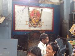 coconut breaking at Manakula Vinayagar Temple