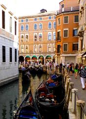 Scenic view of Venice canals with gondolas and historic architecture