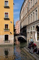 Venice Canal with gondolas and historic buildings