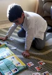 A child pasting stickers during the World Cup in Brazil