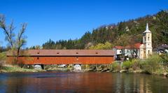 Wooden covered bridge and Church of St. Wenceslas in Radošov