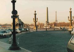 Place de la Concorde at sunset with historic monuments and bustling traffic