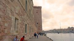 Fort Saint-Jean by the water under a cloudy sky