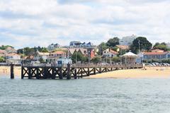 Jetée Eyrac on Arcachon Beach with vintage carousel