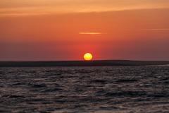 Sunrise at Cap Ferret with beautiful sky colors reflecting on the Atlantic Ocean waves