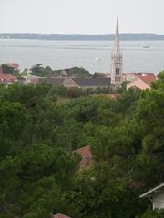 Panoramic view of Arcachon Bay with clear blue sky and boats in the water