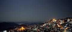 Aizawl city at night during a full moon