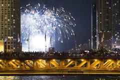 Chicagoans enjoying Navy Pier 4th of July fireworks from Michigan Avenue bridge