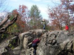 Kids climbing rock near Panther Cave in Middlesex Fells Reservation