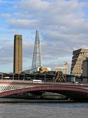 Blackfriars Bridge and Blackfriars Railway Bridge with The Shard and Tate Modern tower in the background from River Thames