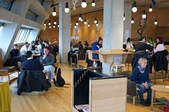 People sitting and working in the Members' Café