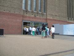 Entrance to Tate Modern with visitors walking