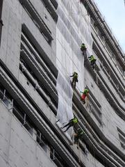 Abseiling workers on the extension to Tate Modern