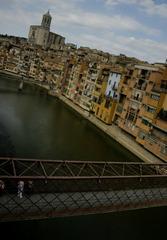 Aerial view of colorful buildings along the Onyar River in Girona, Spain